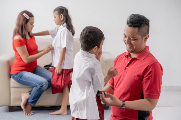 parent help their children getting ready for school - Photo, image