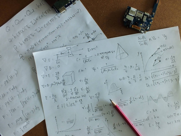 Mathematical equations on a sheet of paper - Photo, Image
