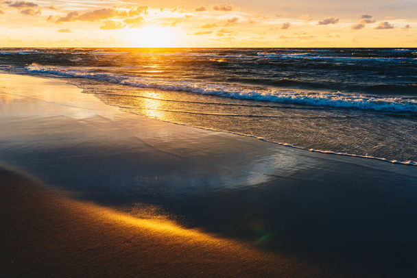 Sunset over the sea sandy beach - Photo, Image