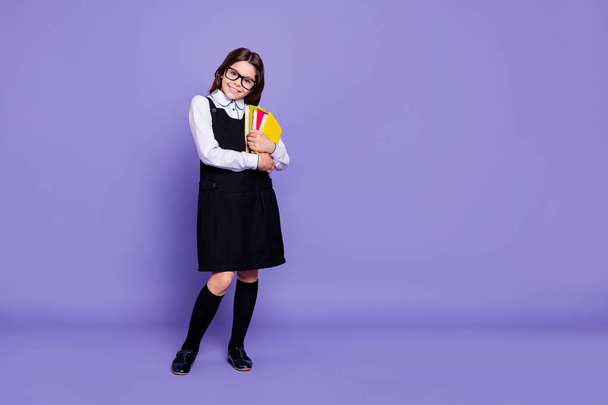 Full length body size view of nice attractive cheerful intelligent wavy-haired pre-teen girl ready to class holding in hands academic literature isolated over bright vivid shine violet background - Foto, imagen