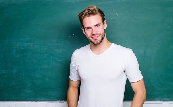 Advantages for male elementary teacher are abundant. Teacher interesting speaker lecturer. Back to school. Teaching could be more fun. Master of simplification. Man teacher in front of chalkboard - Photo, Image