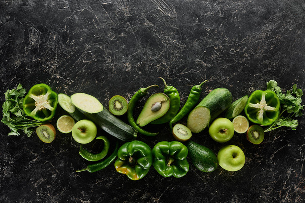 top view of apples, avocados, cucumbers, kiwi, limes, peppers, greenery and zucchini - Fotoğraf, Görsel