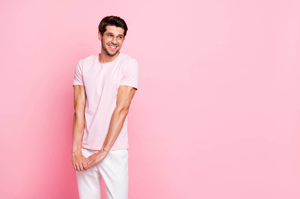 Portrait of his he nice attractive lovely cheerful cheery shy sportive muscular dreamy guy wearing specs posing isolated over pink pastel background - Photo, image