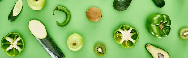 panoramic shot of peppers, zucchini, kiwi, apples and avocados - Foto, Bild