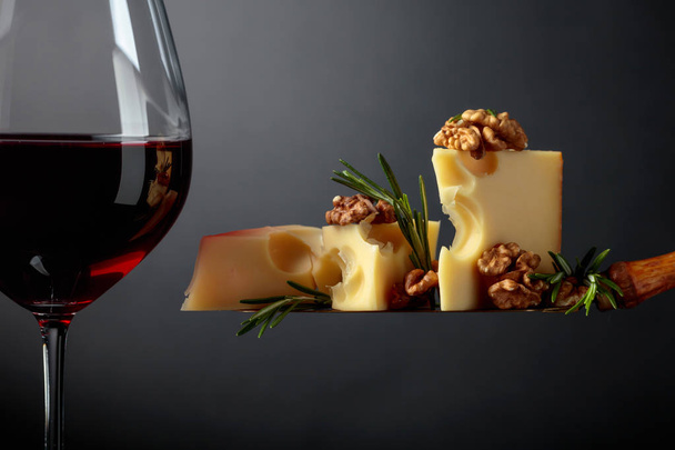  Maasdam cheese with walnuts, rosemary and red wine. - Photo, Image