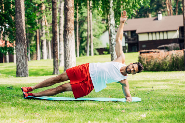 handsome man in sportswear working out outside  - Photo, Image