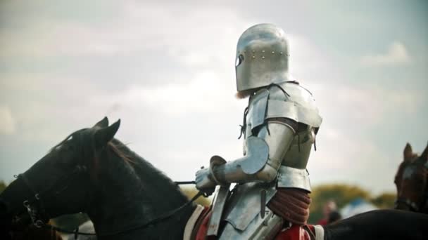 A man knight in the armor riding a horse - another knight comes next to him - Footage, Video