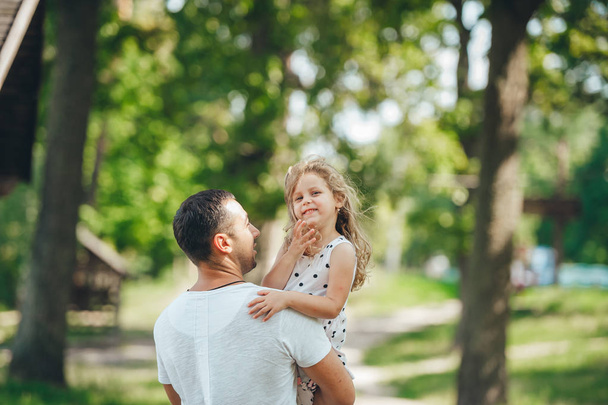 Happy young father with little daughter outdoors.  - Photo, Image