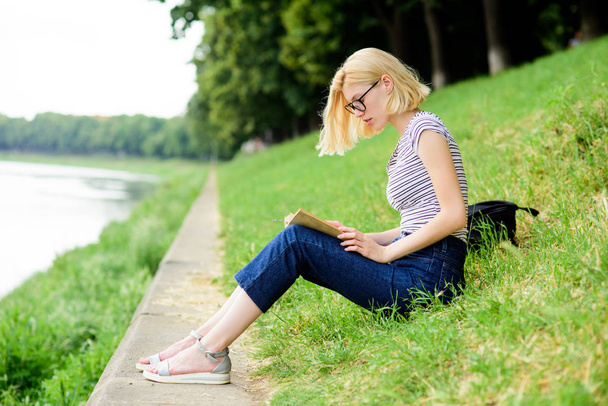 Lost in fairytale. reading is my hobby. Summer study. student girl with book outdoor. inspired by novel author. interesting story. Relax and get new information. woman in park reading book - Foto, Bild