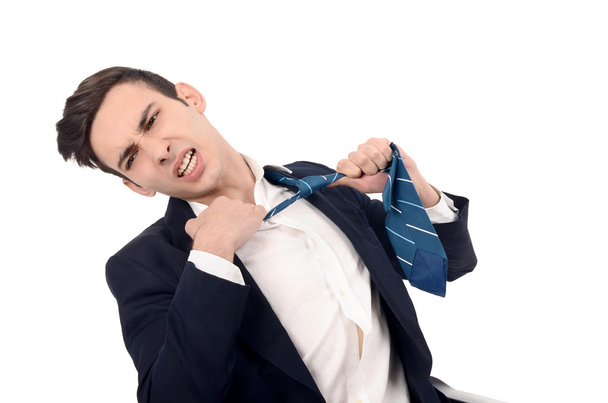 Young business man undressing his suit, pulling his tie. - Photo, Image