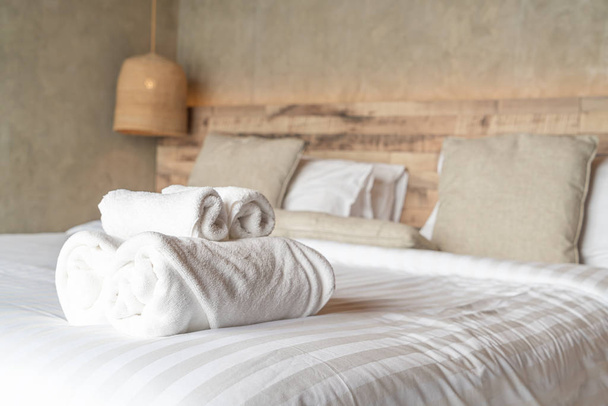 White towel on bed decoration in bedroom  - Foto, Imagen
