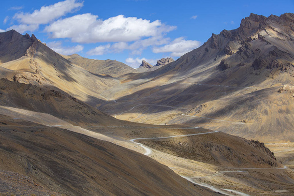 Himalayan mountain landscape along Leh to Manali highway. Winding road and rocky mountains in Indian Himalayas, India - Valokuva, kuva