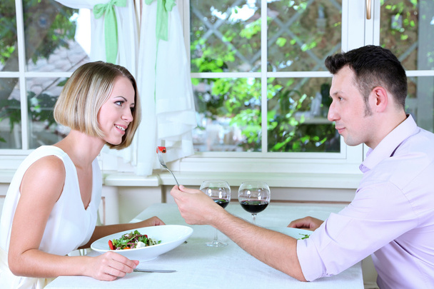 Beautiful couple having romantic dinner at restaurant - Foto, Bild