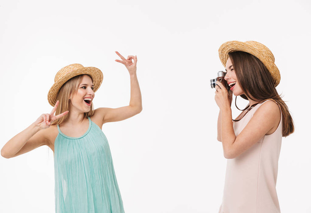 Two cheerful young girls wearing summer clothes - Photo, Image
