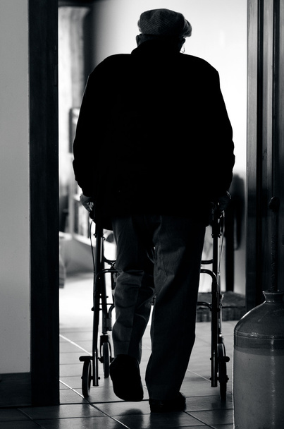 Elderly man use a walker (walking frame) - Foto, imagen