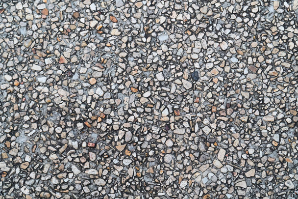 Grunge pebble floor as seamless textured background.Small pebbles mixed with sand texted background. - Photo, Image