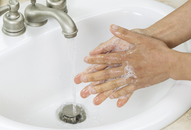 Rinsing soap off hands - Photo, image
