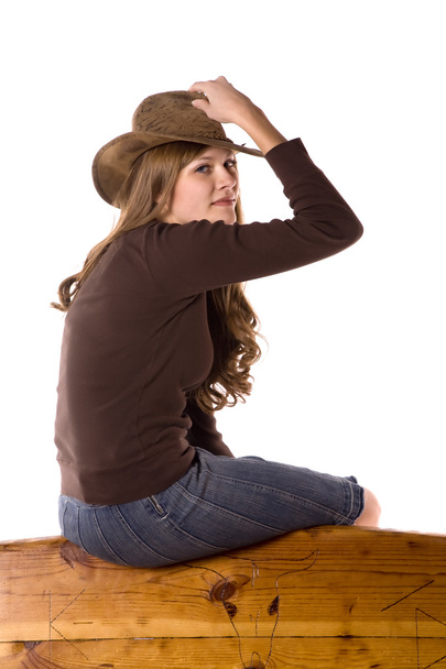 Woman on back of bench holding hat - Foto, Imagem
