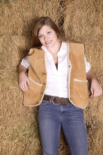 Woman against hay smiling - 写真・画像