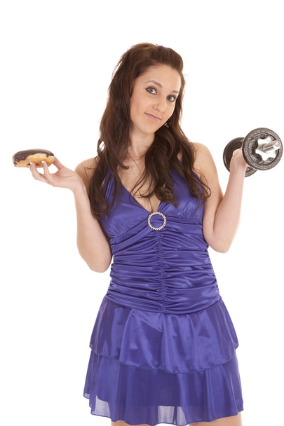 Woman blue dress weights donut smirk - Foto, Imagem
