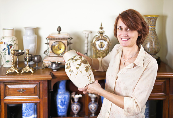 Woman with antique collection - Фото, зображення