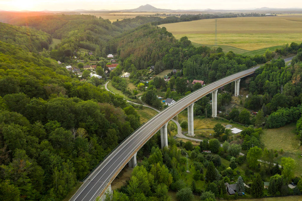 Aerial View of a Highway Bridge With Pillars in the Mountain or Hills With Trees - Zdjęcie, obraz