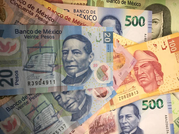 Mexican peso bills spread randomly over a flat surface - Photo, Image