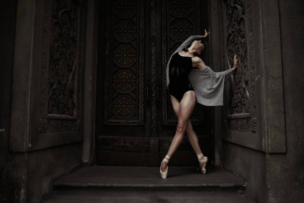 Young and graceful ballerina performing on the street - Foto, Imagem