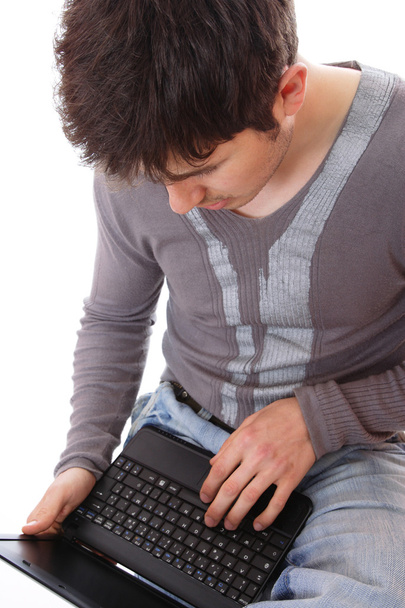 Young man using laptop - Φωτογραφία, εικόνα