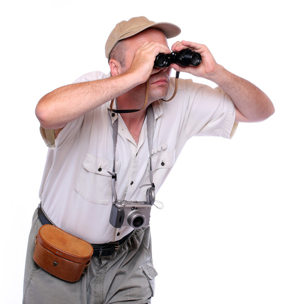 Park ranger watching closely wildlife with his binoculars. Studio shot isolated on white background - Zdjęcie, obraz