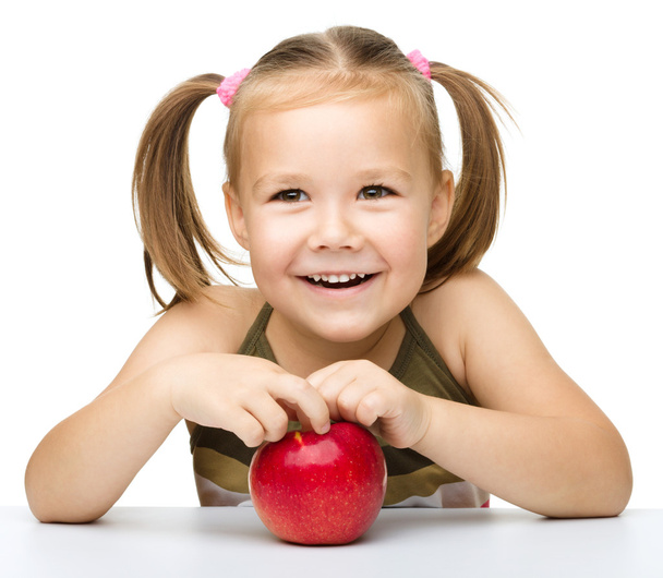 Little girl with red apple - Zdjęcie, obraz