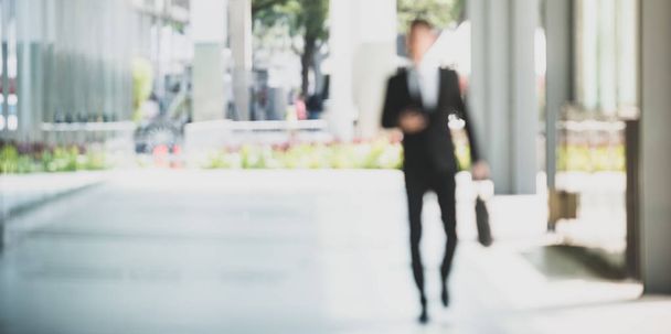 Blurry Travelling Businessman walking outdoor. - Photo, image