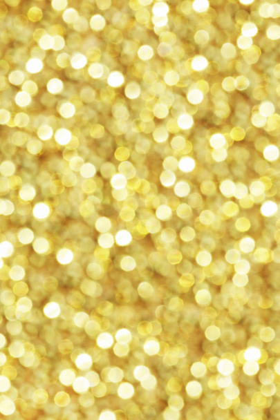 Gold glittering christmas lights. Blurred abstract background. - Photo, Image