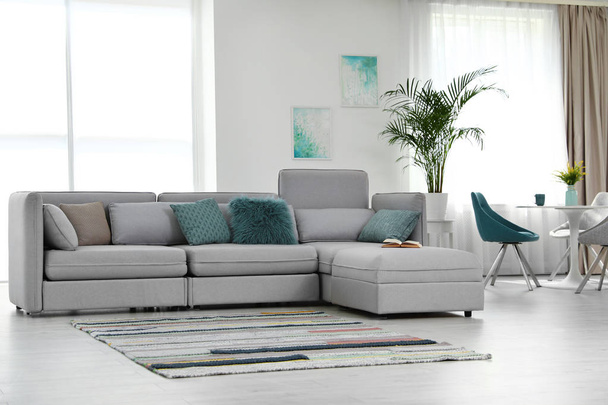Modern living room interior with comfortable sofa - Foto, Imagen