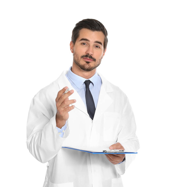 Young male doctor with clipboard on white background. Medical service - Fotó, kép