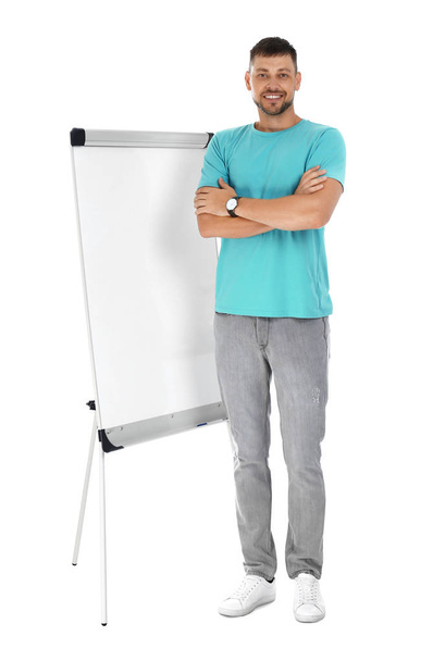 Professional business trainer near flip chart board on white background - Photo, image