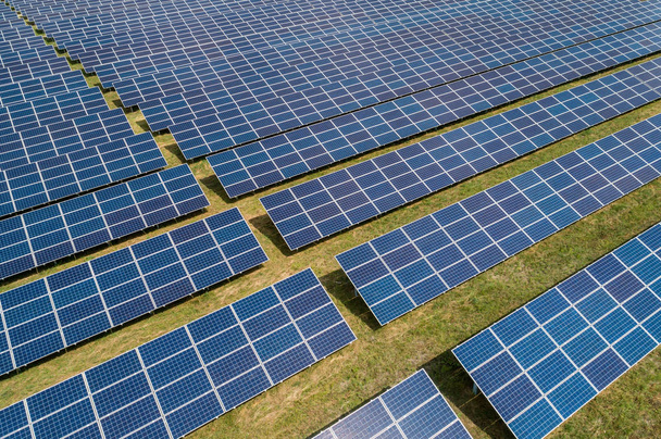 Aerial top view of a sun lit solar panels - Fotografie, Obrázek