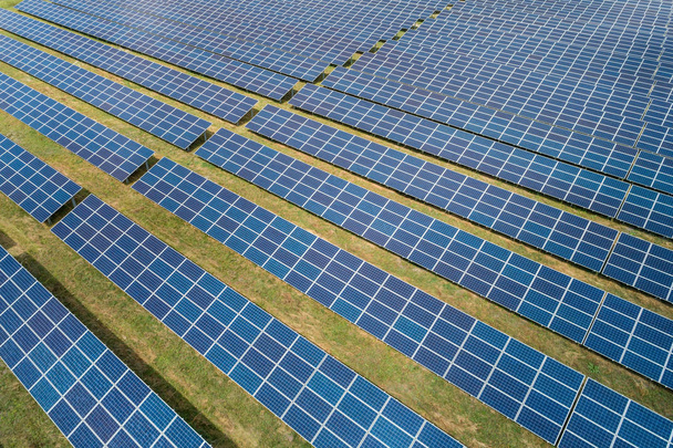 Aerial top view of a sun lit solar panels - Photo, Image