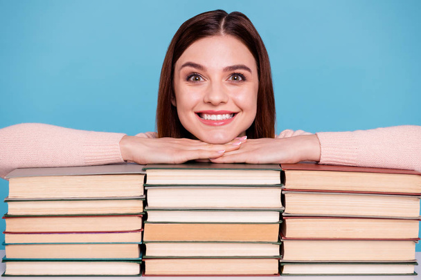 Close-up portrait of her she nice-looking attractive lovely intellectual brainy cheerful girl book shelf preparing exam test pass at work place station isolated over bright vivid shine blue background - Photo, Image