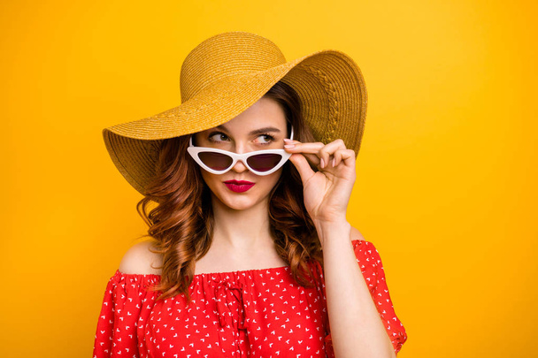 Angry lady look window dislike rainy weather wear red dress sun specs and hat isolated yellow background - Φωτογραφία, εικόνα