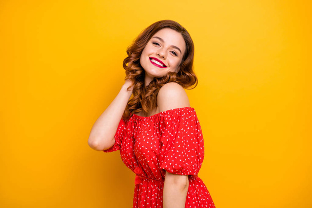 Foxy lady touch curly hairstyle overjoyed by new appearance wear off-shoulders dress isolated yellow background - Foto, immagini