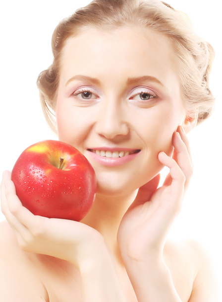 Blond woman with an apple - Foto, immagini