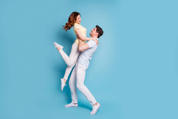 Full length body size profile side view of nice-looking attractive cheerful cheery spouses wearing casual having fun dancing isolated over bright vivid shine blue green background - Zdjęcie, obraz