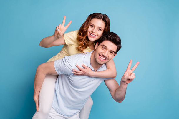Portrait of his he her she nice-looking attractive cheerful cheery glad positive married spouses wearing casual showing v-sign isolated over bright vivid shine blue green background - Foto, imagen