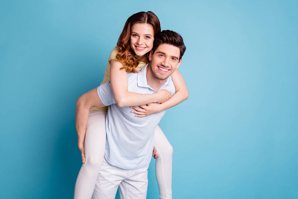 Portrait of his he her she nice-looking attractive lovely funny adorable cheerful cheery married spouses wearing casual having fun isolated over bright vivid shine blue green background - Фото, изображение