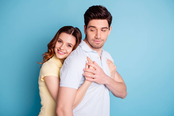 Profile side view portrait of his he her she nice attractive lovely gentle cheerful peaceful calm people wearing casual cuddling isolated over bright vivid shine blue green background - Foto, immagini