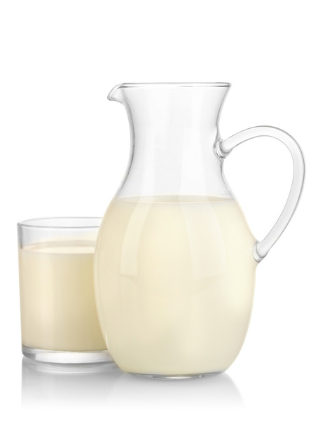 Milk in jug and glass isolated on white - Fotó, kép