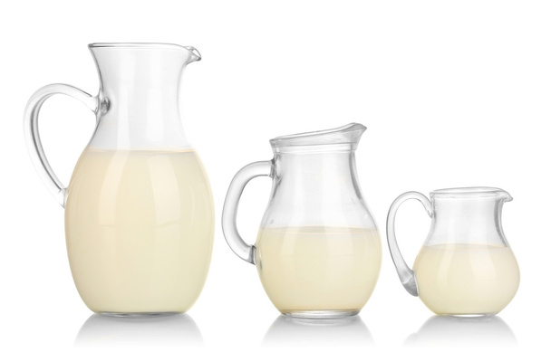Milk in jugs isolated on white - Photo, Image