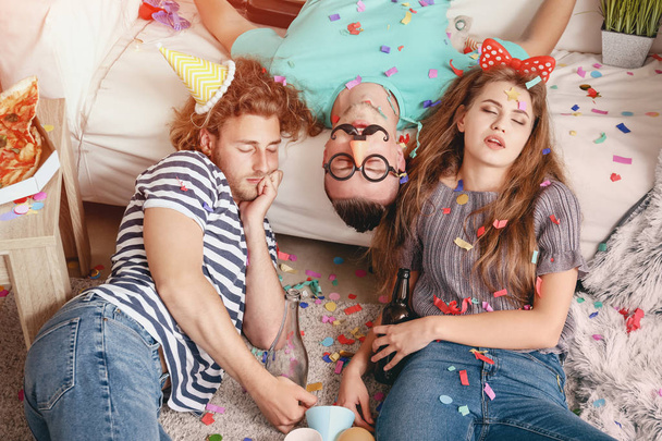 Young people sleeping after party at home - 写真・画像