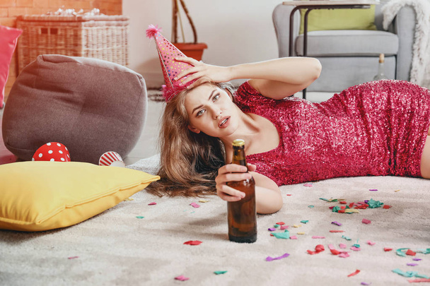 Young woman with hangover after party at home - Фото, изображение